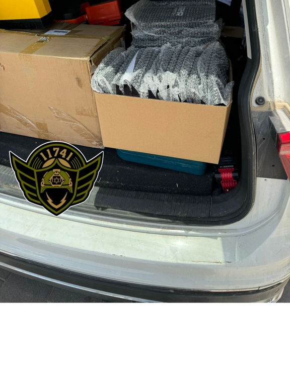 Open car trunk with a box full of bubble wrap
